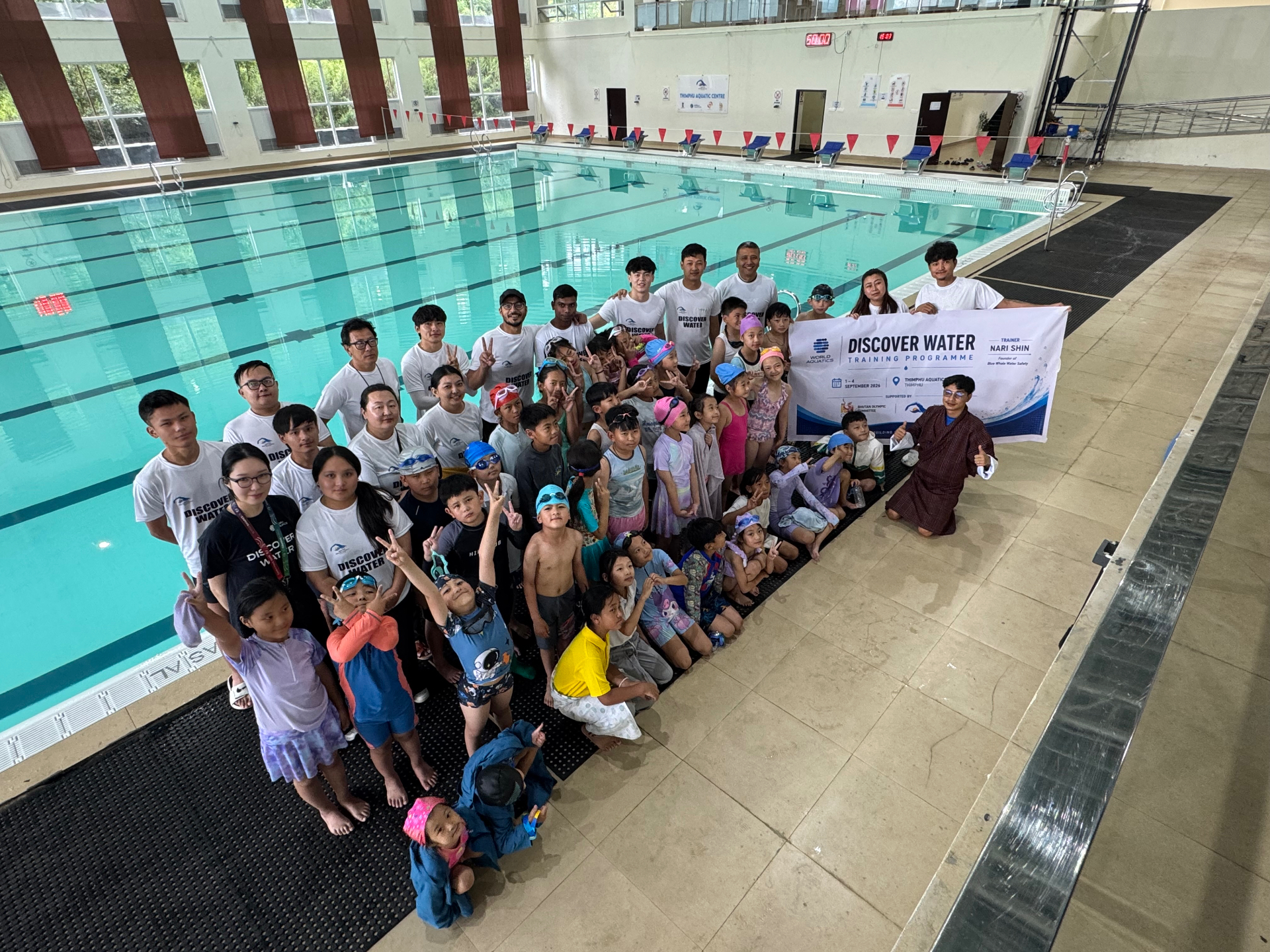 Nari Shin with participants and local schoolchildren at the World Aquatics Discover Water Local Educator Training in Thimphu, Bhutan